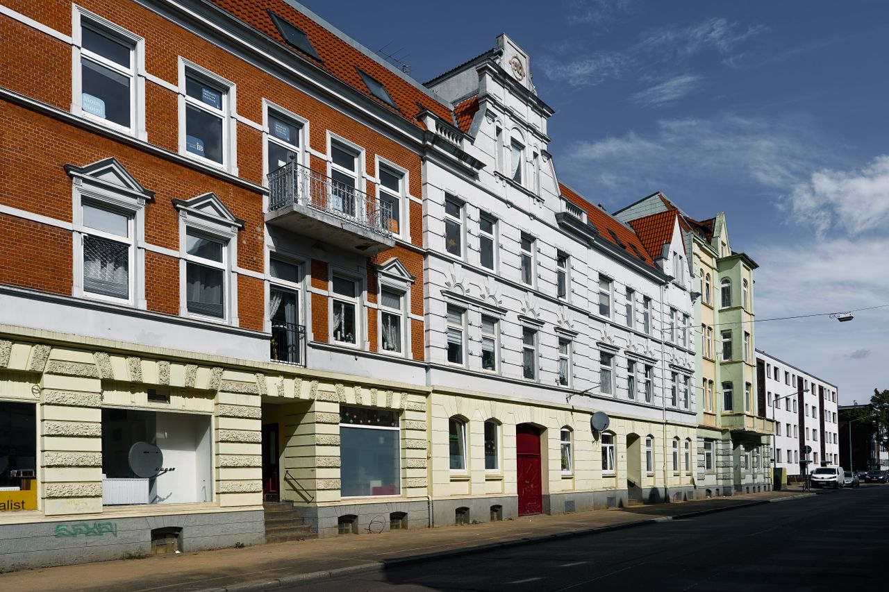Charming old facades of Neum&uuml;nster, Schleswig-Holstein, showcasing diverse architecture.